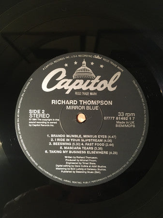 Richard Thompson - Mirror Blue (Vinyl, LP, Album) Very Good Plus (VG+) / Very Good Plus (VG+)