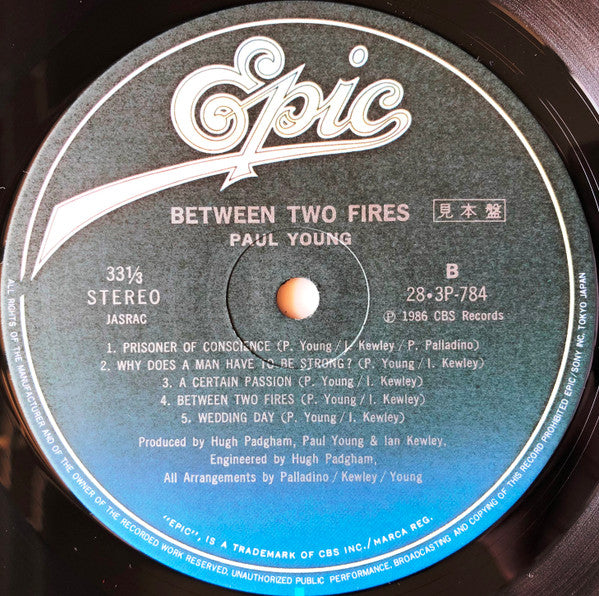 Paul Young - Between Two Fires (Vinyl, LP, Album, Promo) Very Good Plus (VG+) / Very Good Plus (VG+)