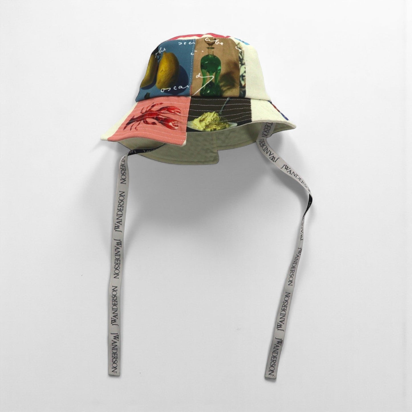J.W.ANDERSON アシンメトリー バケットハット Asymmetric Bucket Hat マルチカラー 総柄 ロゴテープ ストラップ AC0177FA0153019