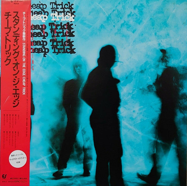 Cheap Trick - Standing On The Edge (Vinyl, LP, Album) Near Mint (NM or M-) / Very Good Plus (VG+)