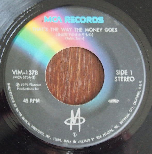 M (2) - That's The Way The Money Goes (Vinyl, 7", 45 RPM, Stereo) Very Good Plus (VG+) / Very Good Plus (VG+)