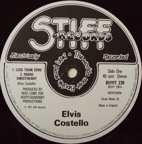 Elvis Costello - Less Than Zero (Vinyl, EP, 12", 45 RPM) Very Good Plus (VG+) / Very Good Plus (VG+)