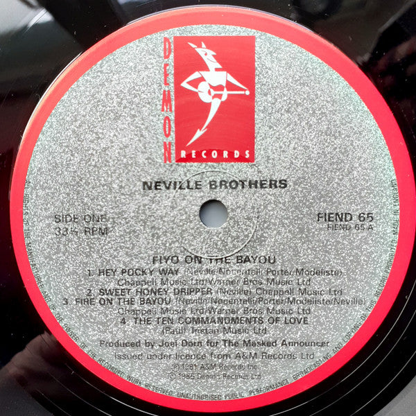 The Neville Brothers - Fiyo On The Bayou (Vinyl, LP, Album, Reissue) Near Mint (NM or M-) / Very Good Plus (VG+)
