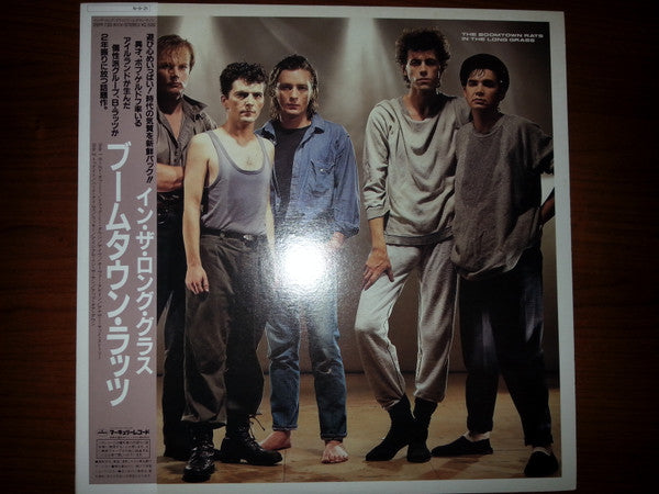 The Boomtown Rats - In The Long Grass (Vinyl, LP, Album) Near Mint (NM or M-) / Near Mint (NM or M-)