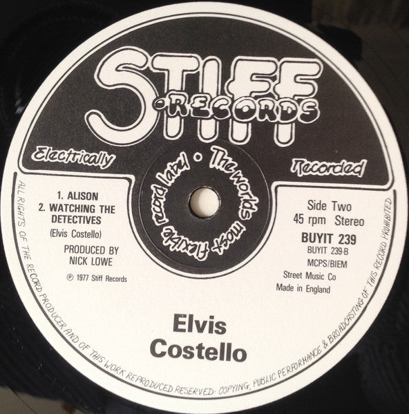 Elvis Costello - Less Than Zero (Vinyl, EP, 12", 45 RPM) Very Good Plus (VG+) / Very Good Plus (VG+)