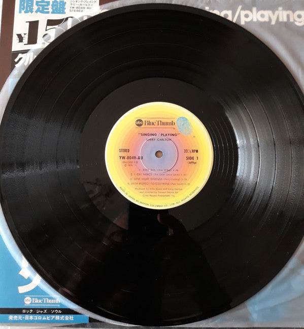 Larry Carlton - Singing / Playing (Vinyl, LP, Album, Repress, Stereo) Near Mint (NM or M-) / Very Good Plus (VG+)