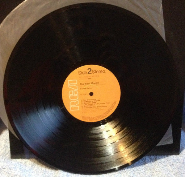 Graham Parker - The Real Macaw (Vinyl, LP, Album) Very Good Plus (VG+) / Very Good Plus (VG+)