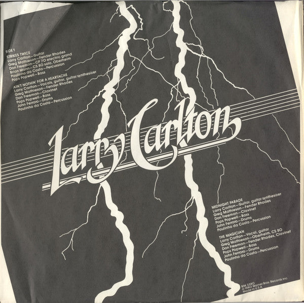 Larry Carlton - Strikes Twice (Vinyl, LP, Album, Misprint) Very Good Plus (VG+) / Very Good Plus (VG+)