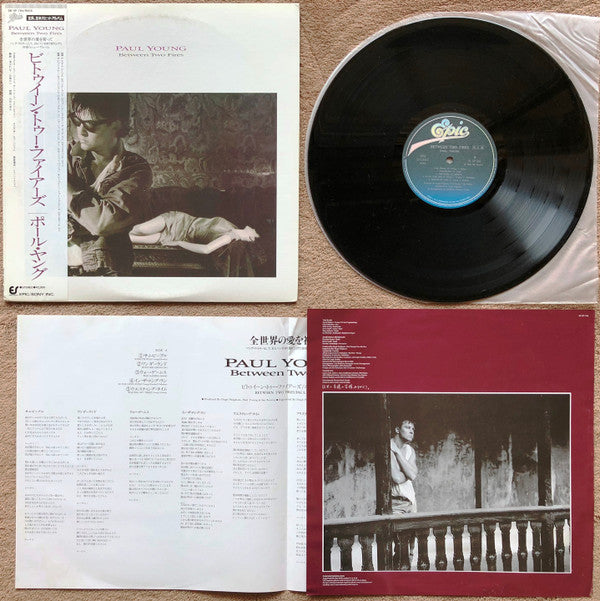 Paul Young - Between Two Fires (Vinyl, LP, Album, Promo) Very Good Plus (VG+) / Very Good Plus (VG+)