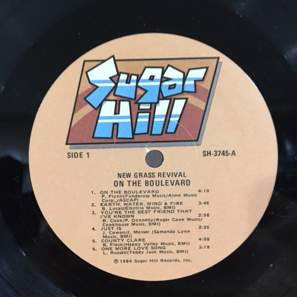 New Grass Revival - On The Boulevard (Vinyl, LP, Album) Very Good Plus (VG+) / Very Good Plus (VG+)