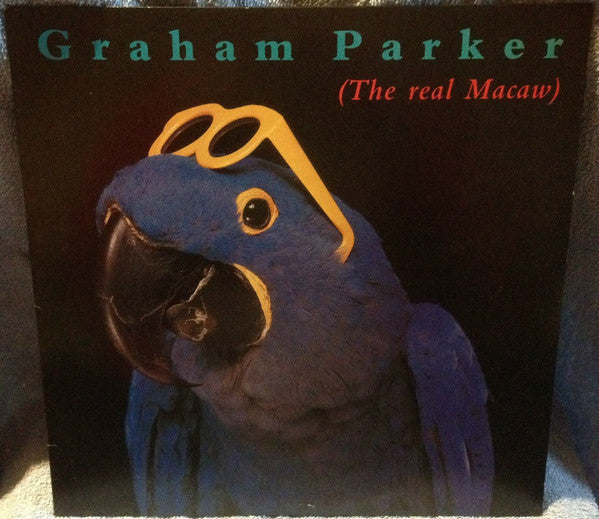 Graham Parker - The Real Macaw (Vinyl, LP, Album) Very Good Plus (VG+) / Very Good Plus (VG+)