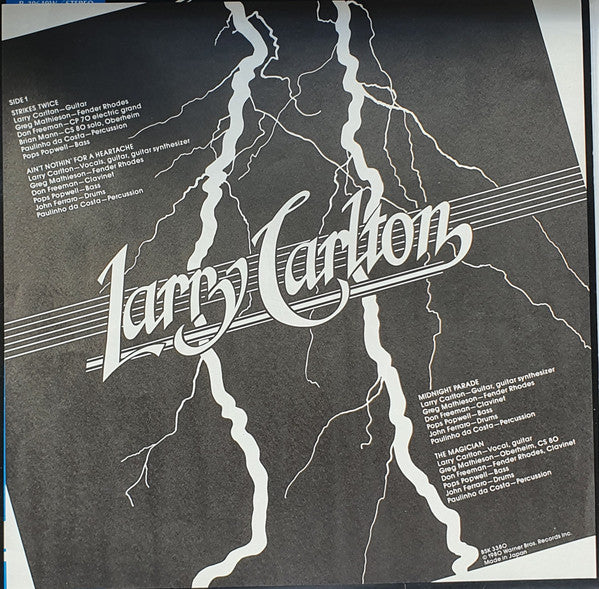 Larry Carlton - Strikes Twice (Vinyl, LP, Album) Very Good Plus (VG+) / Very Good Plus (VG+)
