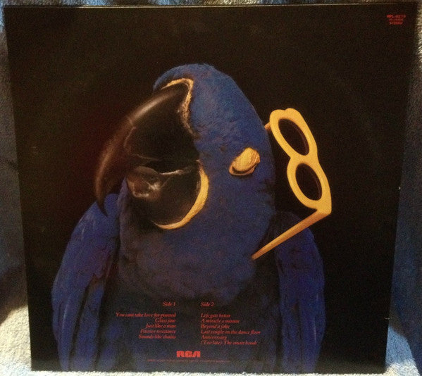 Graham Parker - The Real Macaw (Vinyl, LP, Album) Very Good Plus (VG+) / Very Good Plus (VG+)