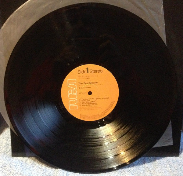 Graham Parker - The Real Macaw (Vinyl, LP, Album) Very Good Plus (VG+) / Very Good Plus (VG+)