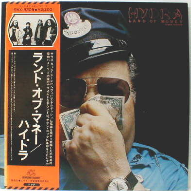 Hydra (13) - Land Of Money (Vinyl, LP, Album) Near Mint (NM or M-) / Very Good Plus (VG+)