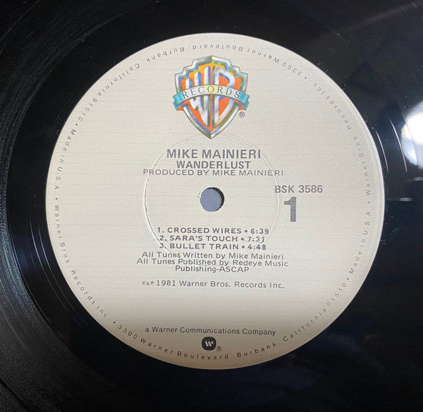 Mike Mainieri - Wanderlust (Vinyl, LP, Album) Very Good Plus (VG+) / Very Good Plus (VG+)