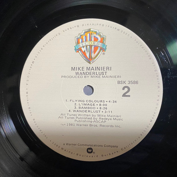 Mike Mainieri - Wanderlust (Vinyl, LP, Album) Very Good Plus (VG+) / Very Good Plus (VG+)