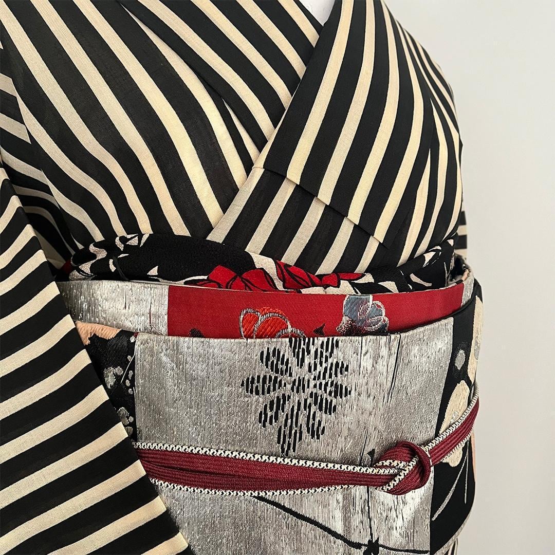 Retro-modern Chirimen Obiage (Sash) with a deep scarlet Yumeji rose on a sandy background.